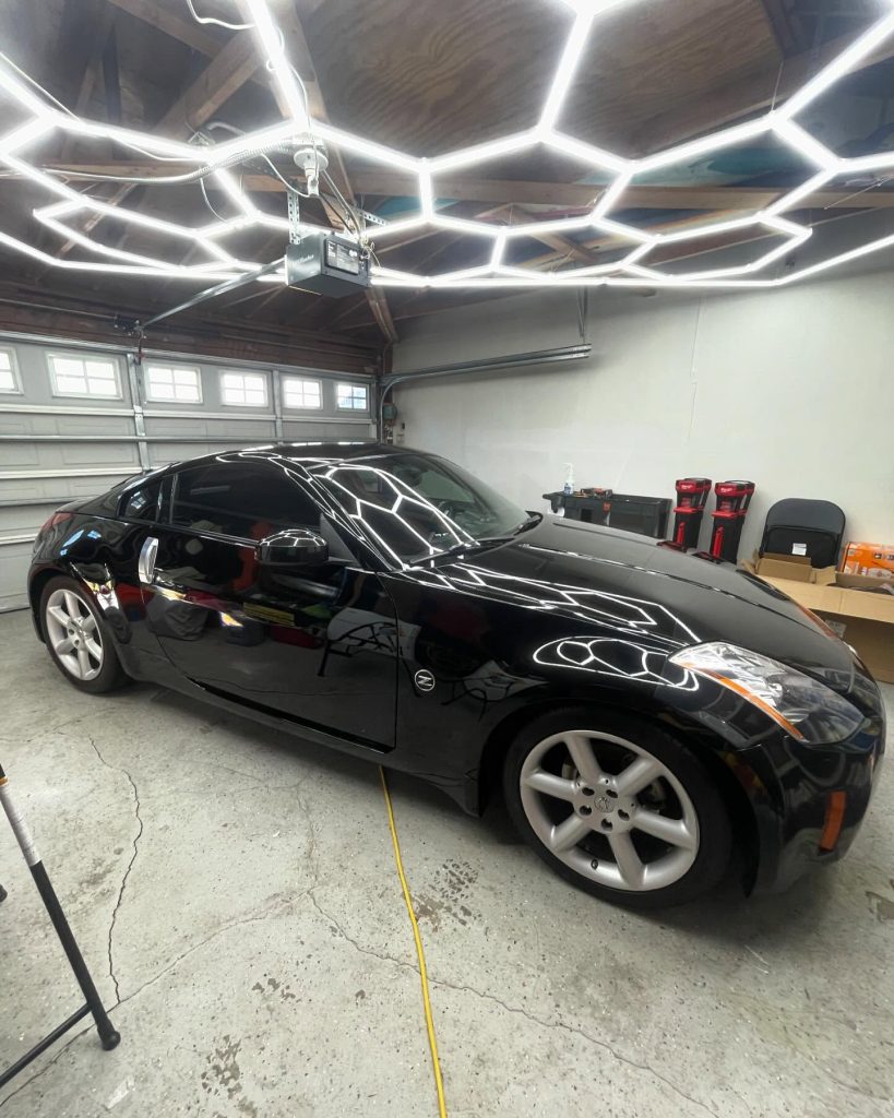 Black Nissan 350Z with a mirror-gloss finish after detailing at Logan's Van Nuys studio