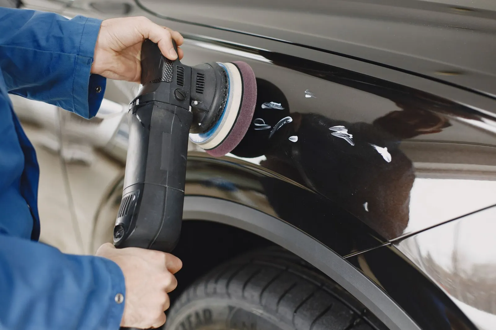 Machine-polishing paint during coating prep — the step that separates real installers
