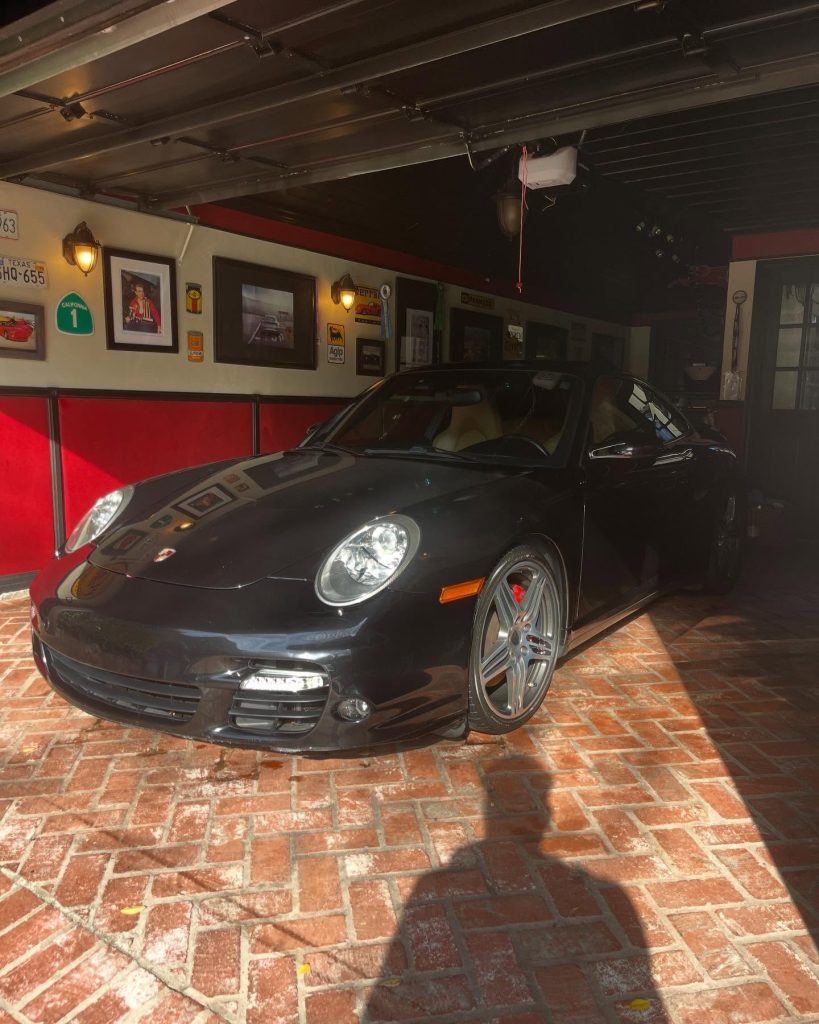 A car gleaming under the sun after professional detailing in Sherman Village