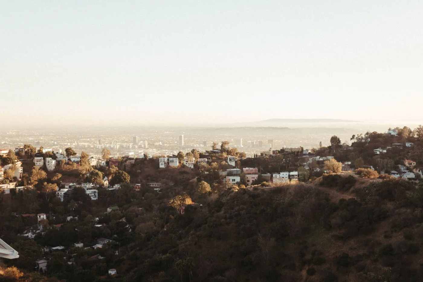 Hillside homes above the Los Angeles basin, like the north Valley communities around Porter Ranch